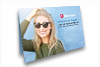 Front panel of direct mail print piece with smiling young woman wearing sunglasses and the text Future's so bright... Glow up your business with print and promo products.