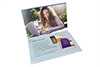 First reveal of a four panel print piece with smiling young woman on computer and promo items